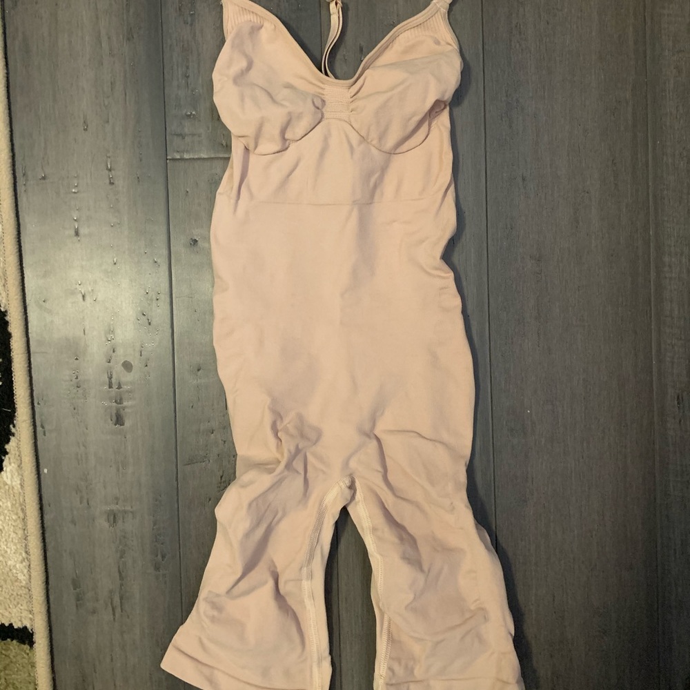Skims sculpting body suit mid-thigh